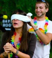 man blindfolding woman to hide a surprise